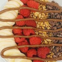 Raspberry Nutella Favorite · Raspberry Nutella base topped with banana, raspberry, granola, cocoa nibs & Nutella