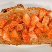 Cookie Butter Toast · House made cookie butter topped with fresh strawberries and cinnamon