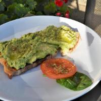 Avocado Toast · Avocado smash on toasted sourdough bread topped with a drizzle of extra virgin olive oil, cr...