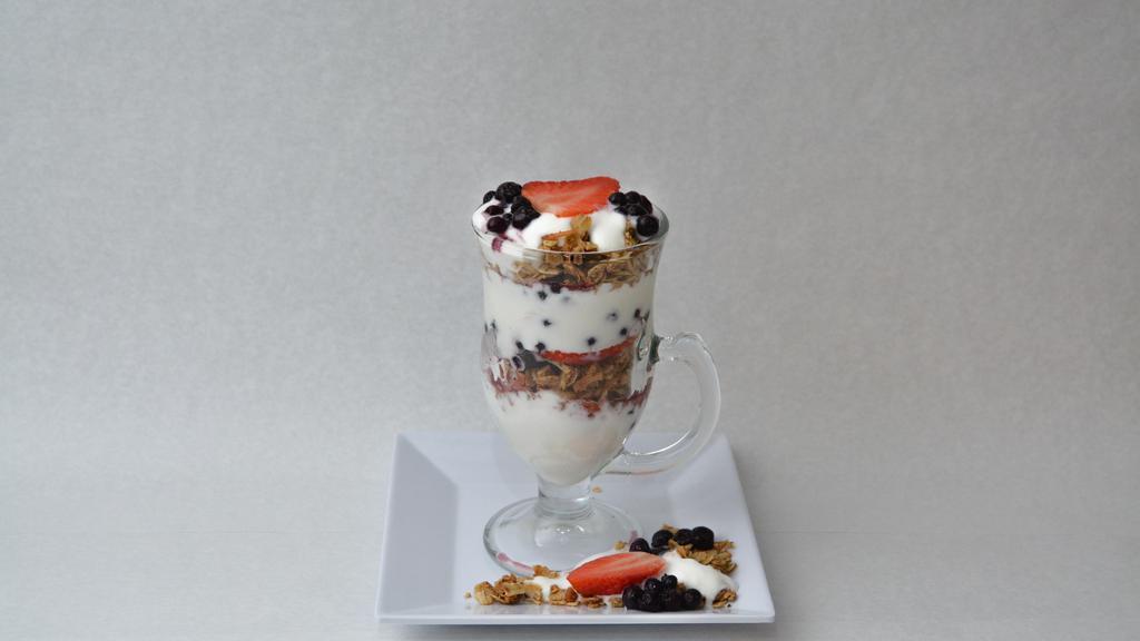 Fruit And Yogurt Parfait · Strawberries and blueberries with vanilla yogurt and our house made granola