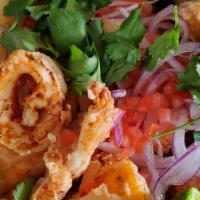 Jalea Nortena · Fried Calamari, Shrimp, white fish, yucca, sweet potato served with aji tartar and salsa cri...