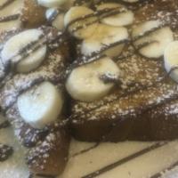 Nutella Banana French Toast · Foodie favorite. Topped with banana and drizzled with Nutella spread.