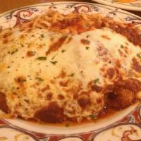 Chicken Parmigiana · Breaded chicken cutlet, topped with tomato sauce and mozzarella cheese, baked and served wit...