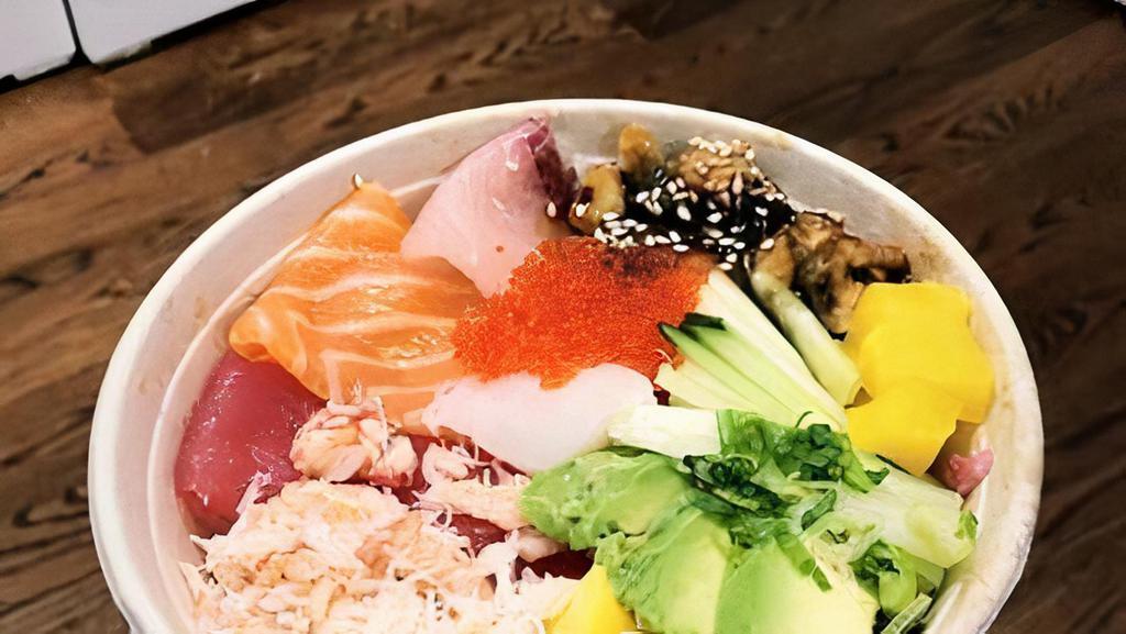 Spicy Salmon Sashimi Rice Bowl · Spicy salmon over sushi rice with sliced cucumber, radish, ginger, crunchy greens, and sesame seeds.