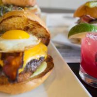 The Brunch Burger · 8oz signature burger blend, american cheese, apple-wood smoked bacon, hash brown, sunny side...