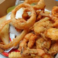 Fried Shrimp & Onion Rings With Hot Sauce · A generous portion of Hot N' Fresh Fried Shrimp, served on a bed of onion rings. Served with...