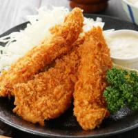 Garlic Parmesan Chicken Tender Basket With Onion Rings · Delicious chicken tenders, tossed in Garlic Parmesan sauce, and fried to perfection. Served ...