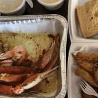Seafood Sampler · Shrimp, scallops, crab legs, lobster tails, crab cakes, fish & potato salad.