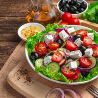 Greek Salad · Fresh Salad made with Romaine tomatoes, bell peppers, onions, Kalamata olives, cucumbers, or...