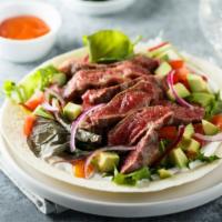 Mexican Steak Salad · Fresh Salad made with Skirt steak, mixed greens, avocado, corn, black beans, tomatoes and ba...