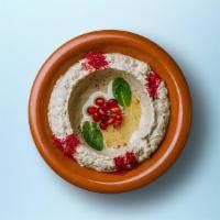 Best Ever Baba Ghanoush · Roasted eggplants mashed and mixed in with garlic, olive oil, tahini sauce, and fresh lemon ...