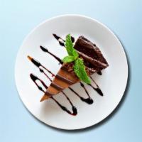 Chocolate Cake Yumm · House-made chocolate cake flavored with melted chocolate and cocoa powder.