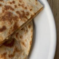 Quesadilla · Chihuahua cheese, green chili, pico de gallo, mexican crema on flour tortilla
