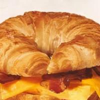 Triple Bacon Sandwich · A buttery croissant with loads of applewood bacon, two eggs and choice of cheese.