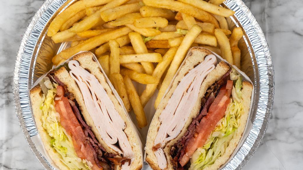 Turkey Triple Decker · Boar's head turkey and bacon, lettuce, tomatoes, and mayo served on a choice of sliced bread.