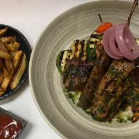 Pergola Mixed Grill For Two · Colorado lamb chops, barbecue beef rib chicken kebab, merguez, kofta kebab served with hand ...
