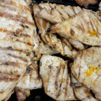Grilled Chicken · Cooked on a rack over a grill.