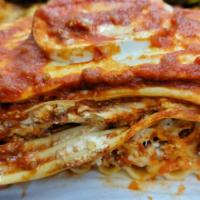 Meat Lasagna · Italian dish made of stacked layers of thin flat pasta alternating with fillings. Layered di...