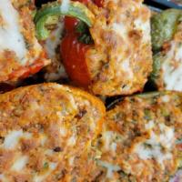 Stuffed Peppers · Hollowed out and then filled with a variety of seasoned ingredients.