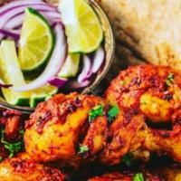 Tandoori Chicken · Nuts. Chicken drumsticks marinated in yogurt and herbs grilled in clay oven. Served with ric...