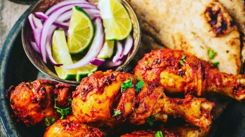 Tandoori Chicken · Nuts. Chicken drumsticks marinated in yogurt and herbs grilled in clay oven. Served with rice, salad, and mint chutney.