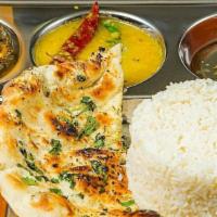 Paneer Tikka · Nuts. Cottage cheese marinated in yogurt and herbs grilled in a clay oven. Served with rice,...