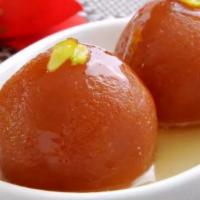 Gulab Jamun · Indian munchkins in cardamom flavored simple syrup.