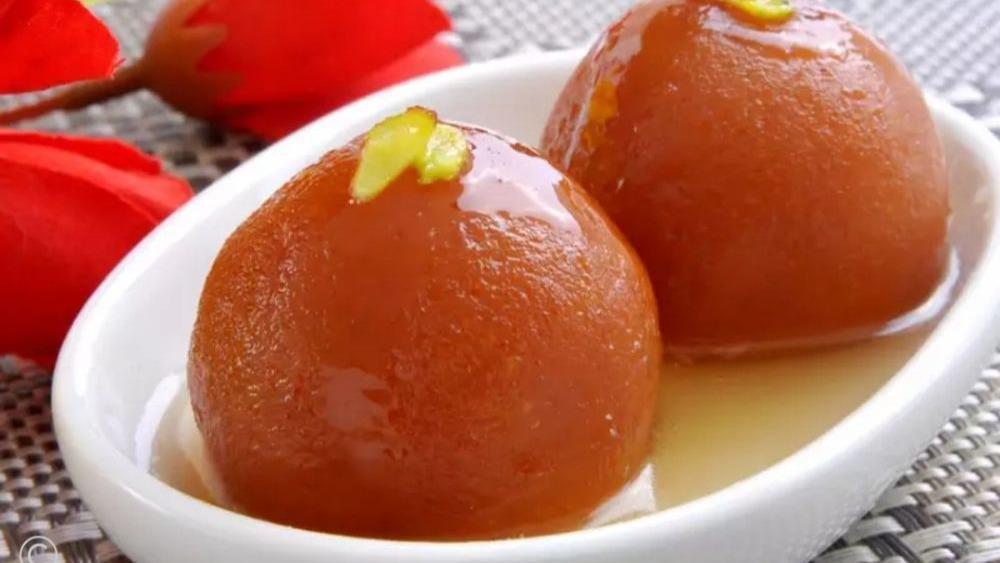 Gulab Jamun · Indian munchkins in cardamom flavored simple syrup.