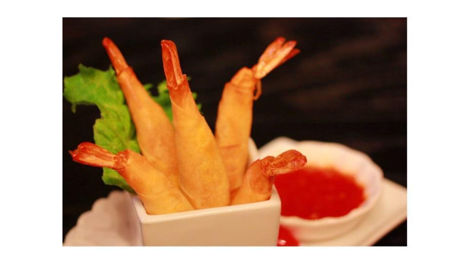Shrimp Roll · Shrimp wrapped in an egg roll skin served with sweet chili dipping sauce.