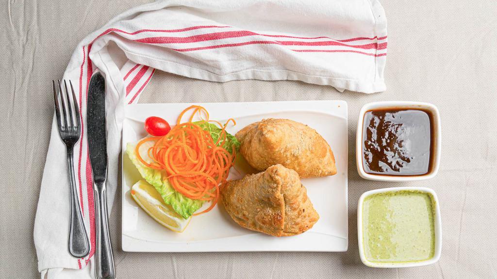 Veg Samosa · Spiced mashed potatoes stuffed in a delicate Indian pastry.