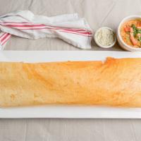 Masala Dosa Or Plain Dosa Or Mysore Dosa · Spicy. A paper thin crepe stuffed with spiced potatoes, served with coconut chutney and samb...
