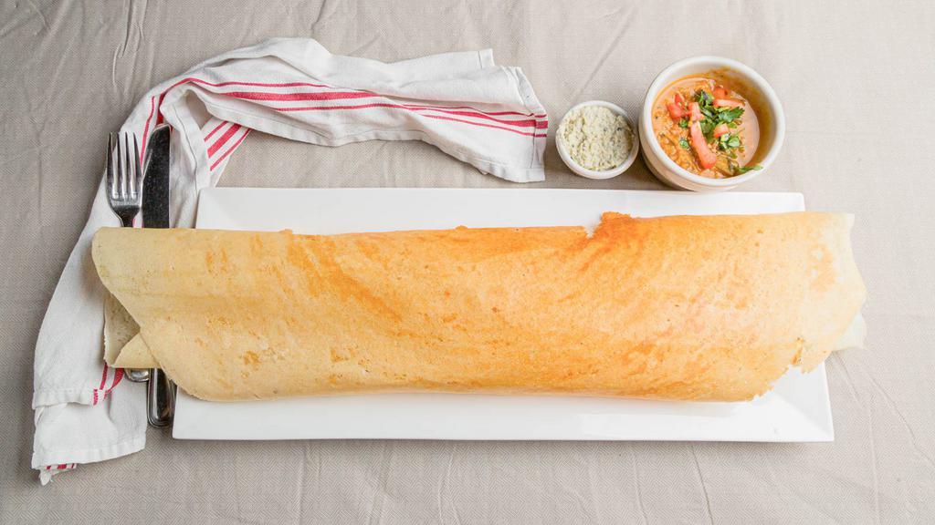 Masala Dosa Or Plain Dosa Or Mysore Dosa · Spicy. A paper thin crepe stuffed with spiced potatoes, served with coconut chutney and sambar.