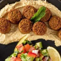 Falafel Appetizer  · Served with hummus, rice, and garnish.