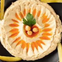 Hummus · Pureed chickpeas with sesame oil and hint of garlic.