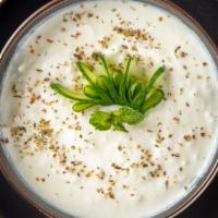 Cacik · Diced cucumber in yogurt with a hint of garlic and mint.