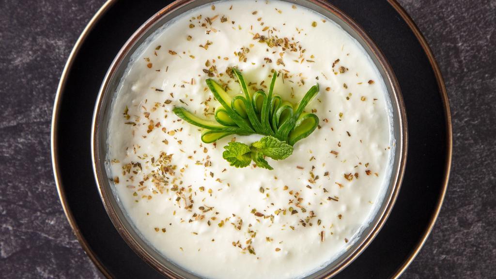 Cacik · Diced cucumber in yogurt with a hint of garlic and mint.