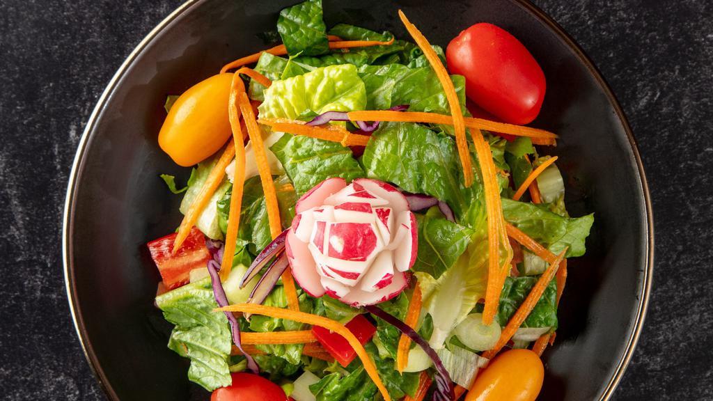 Garden Salad · Romaine lettuce, tomatoes cucumbers and carrots with lemon juice and extra virgin olive oil dressing.