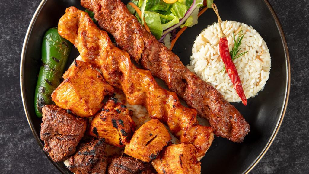 Mix Kebab · Adana kebab, chicken shish kebab, lamb shish kebab and your choice of gyro, kofte or chicken adana. Served with rice, garnish, and grilled hot pepper.