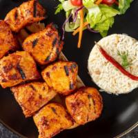 Chicken Shish Kebab · Skewered marinated chicken breast. Served with rice, garnish, and grilled hot pepper.