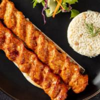 Chicken Adana Kebab · Skewered ground chicken-charcoal broiled. Served with rice, garnish, and grilled hot pepper.