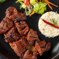 Lamb Shish Kebab · Charcoal broiled tender cubes of lamb marinated with our chef's seasoning. Served with rice,...