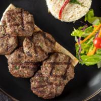 Kofte Kebab · Parsley, white onion and cumin get together with ground beef. Served with rice, garnish, and...