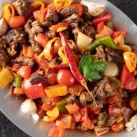 Sauteed Beef · Chunks of beef sauteed with green and red bell pepper, tomato and oregano. Served with rice.