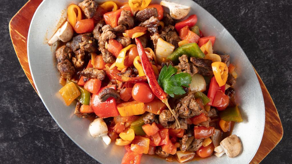 Sauteed Beef · Chunks of beef sauteed with green and red bell pepper, tomato and oregano. Served with rice.