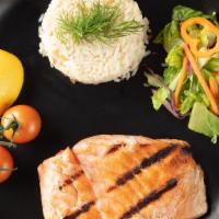 Salmon · Grilled salmon, served with garden salad and rice.