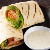 Adana Kebab Wrap · Served lettuce, and tomatoes, white sauce.