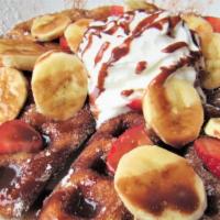 Nutella Churro Waffles · Fresh strawberries, bananas, whipped cream and drizzled with Nutella.