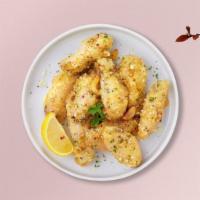 Garlic Guerilla Wings · Fresh chicken wings breaded, fried until golden brown, and tossed in garlic and parmesan. Se...