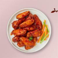Follow The Buffalo Wings · Fresh chicken wings breaded, fried until golden brown, and tossed in buffalo sauce. Served w...