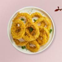 Onion Rings · Sliced onions dipped in a light batter and fried until crispy and golden brown. Served with ...